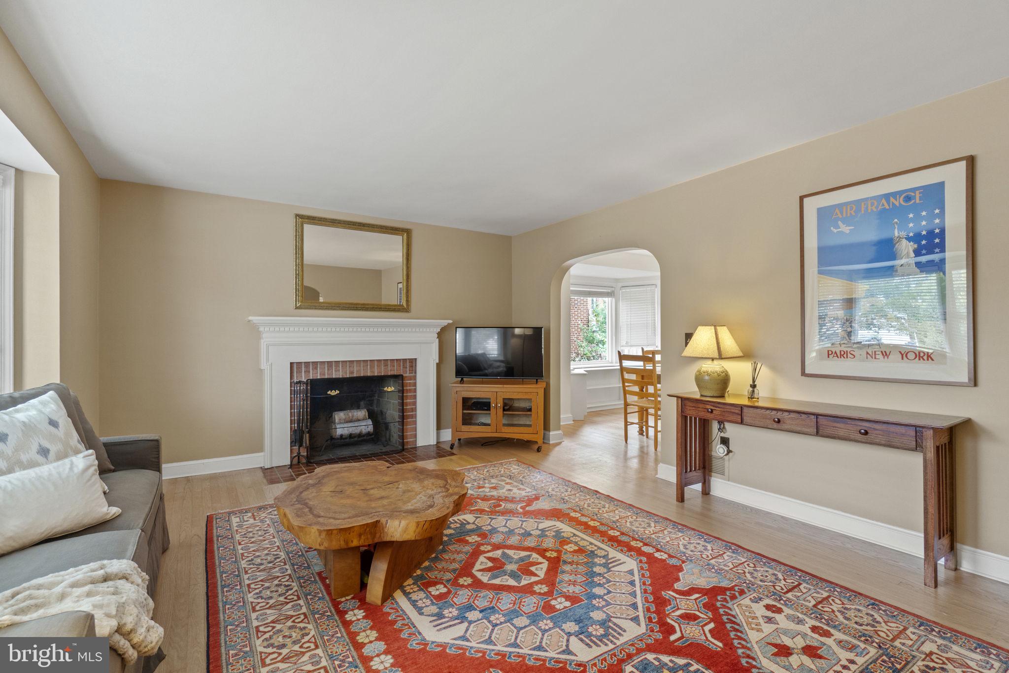 1008 Lanark Way Silver Spring, MD 20901 - Photo 4 of 26 The living room has a cozy wood burning fireplace.