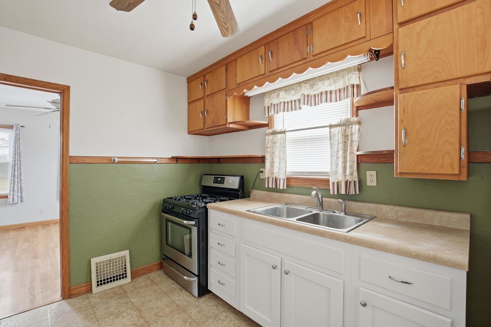 608 7th Avenue Silvis, IL 61282 - Photo 13 of 38 a kitchen with a sink and cabinets