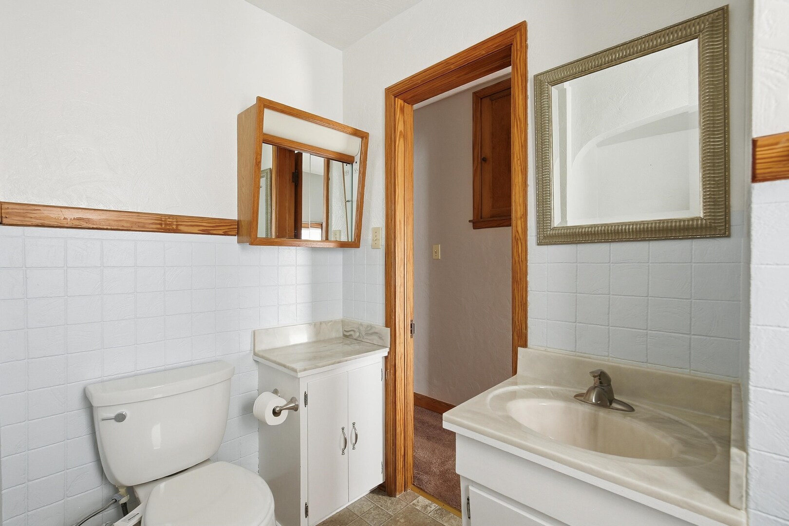 608 7th Avenue Silvis, IL 61282 - Photo 21 of 38 a bathroom with a toilet sink and mirror