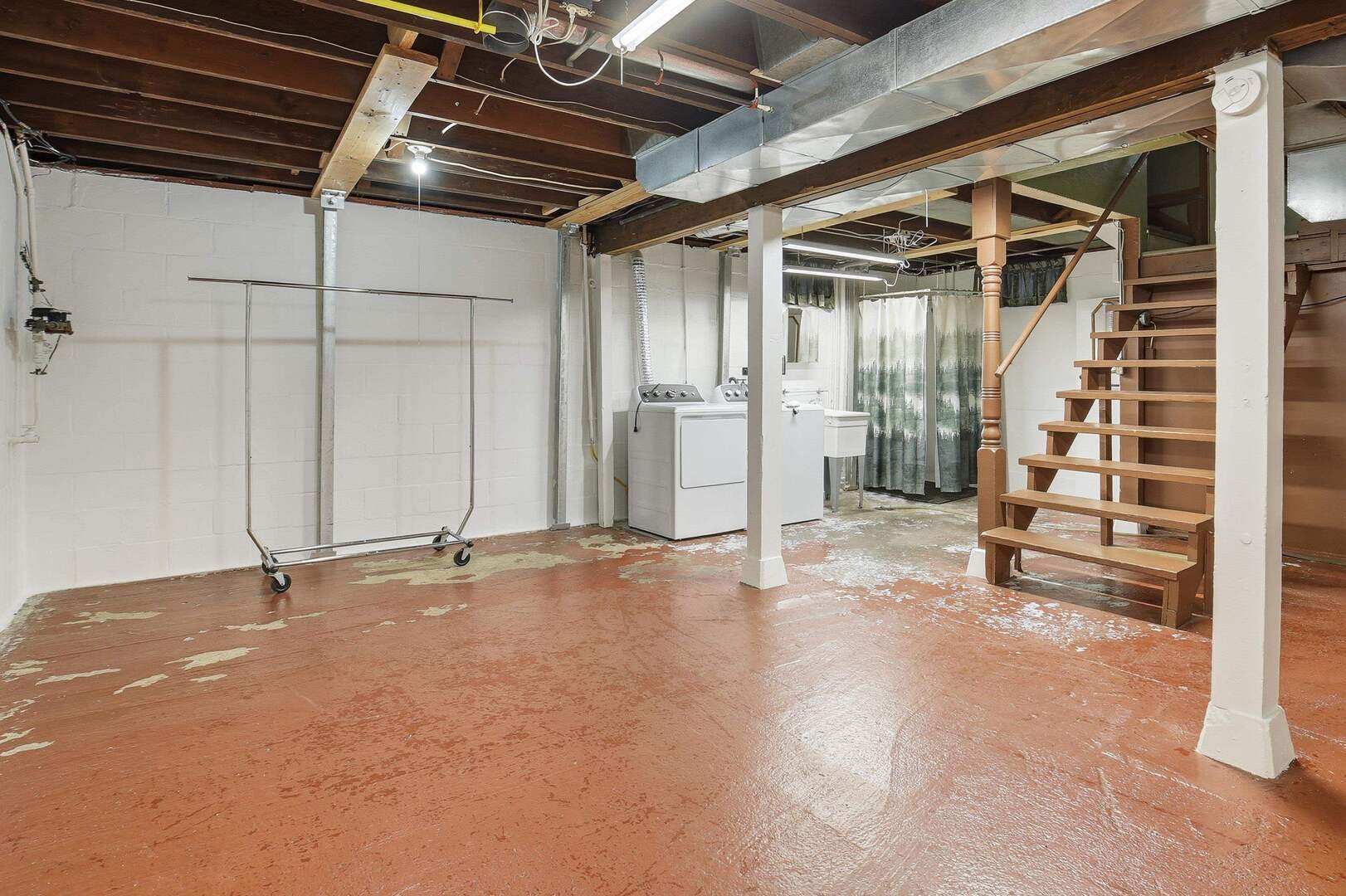 608 7th Avenue Silvis, IL 61282 - Photo 25 of 38 a view of an empty room with wooden floor and stairs