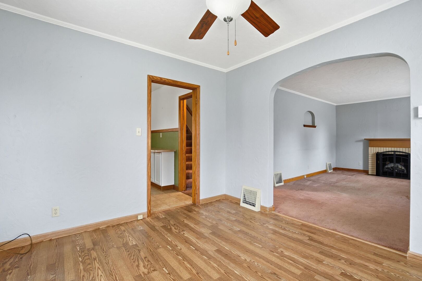 608 7th Avenue Silvis, IL 61282 - Photo 10 of 38 a view of empty room with wooden floor and fireplace