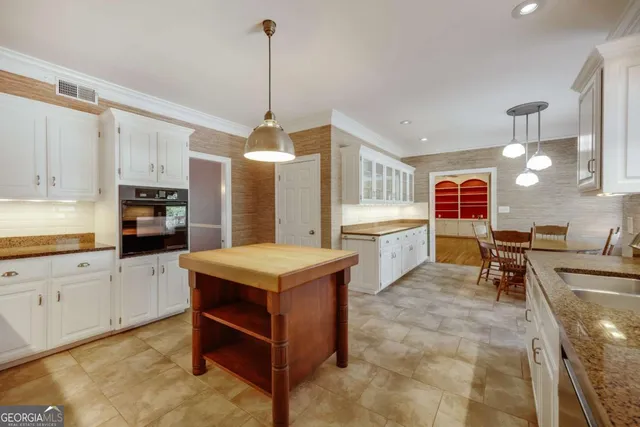a view of a room with stairs and wooden floor