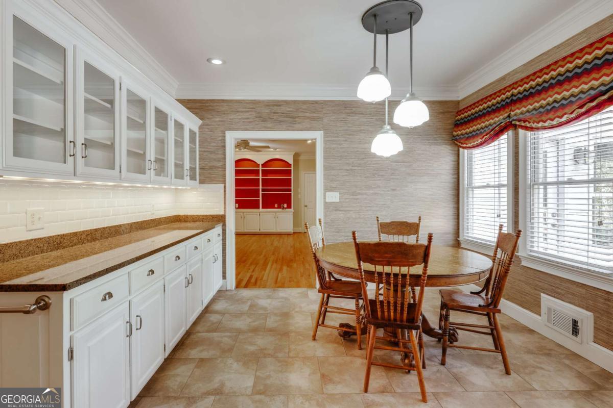 150 Walton Creek Road Athens, GA 30607 - Photo 17 of 72 a view of a dining room with furniture and chandelier