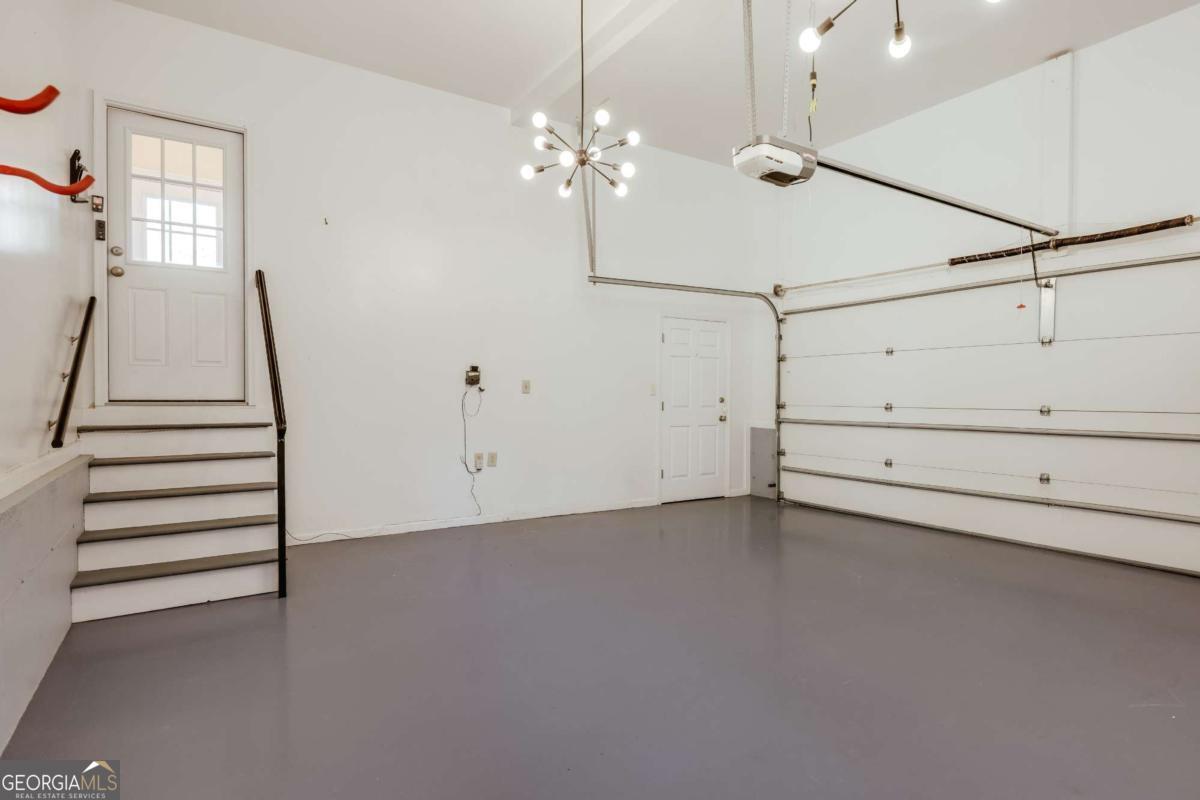 150 Walton Creek Road Athens, GA 30607 - Photo 21 of 72 a view of a room with stairs and wooden floor