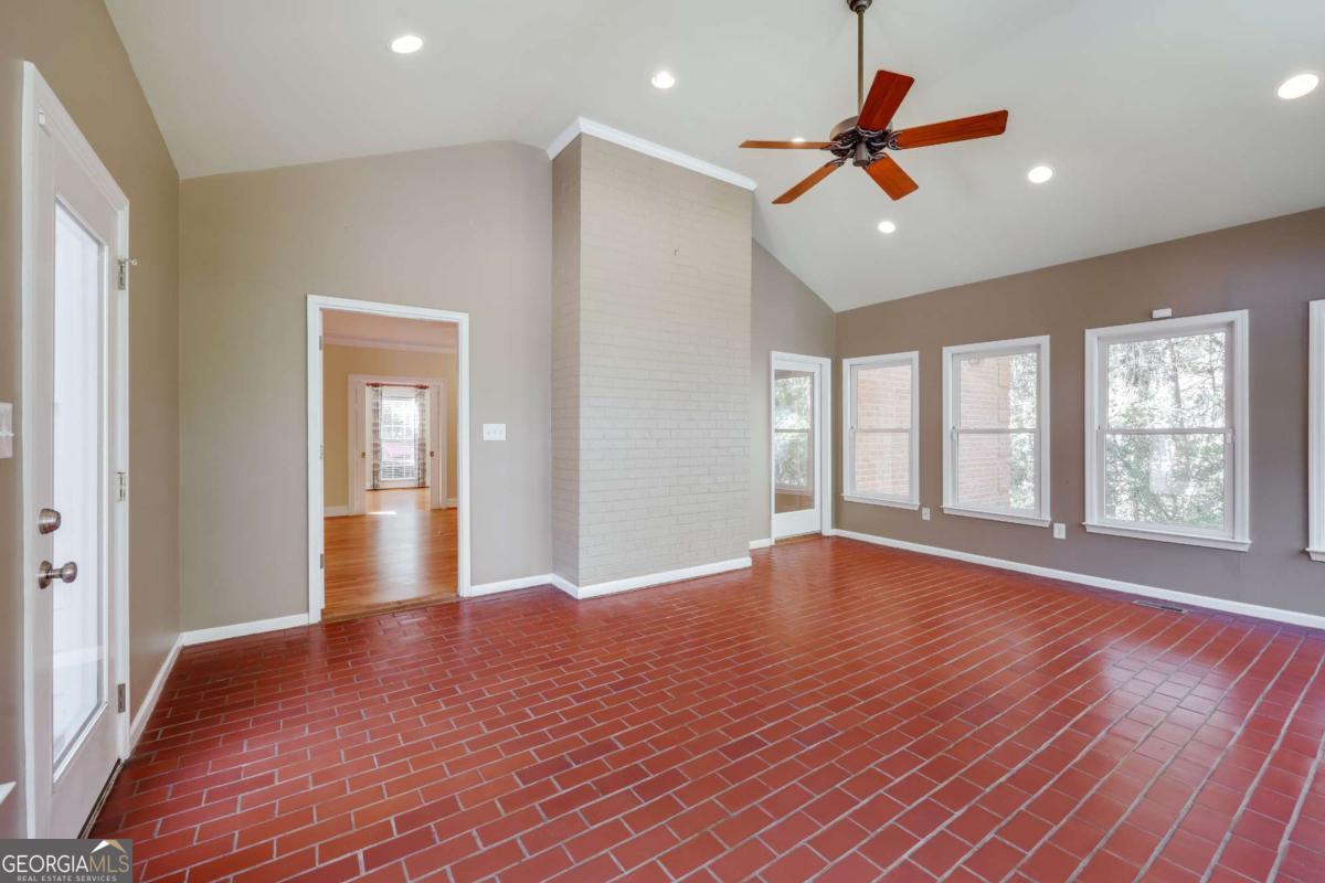 150 Walton Creek Road Athens, GA 30607 - Photo 25 of 72 a view of an empty room with wooden floor and a window