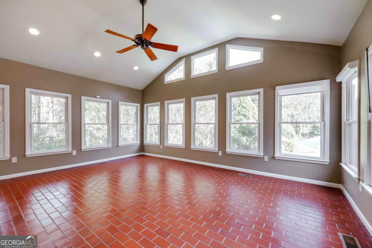 150 Walton Creek Road Athens, GA 30607 - Photo 26 of 72 a view of an empty room with wooden floor and a window