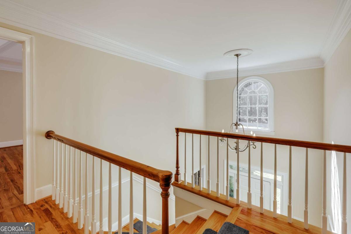 150 Walton Creek Road Athens, GA 30607 - Photo 33 of 72 a view of staircase with railing and wooden floor
