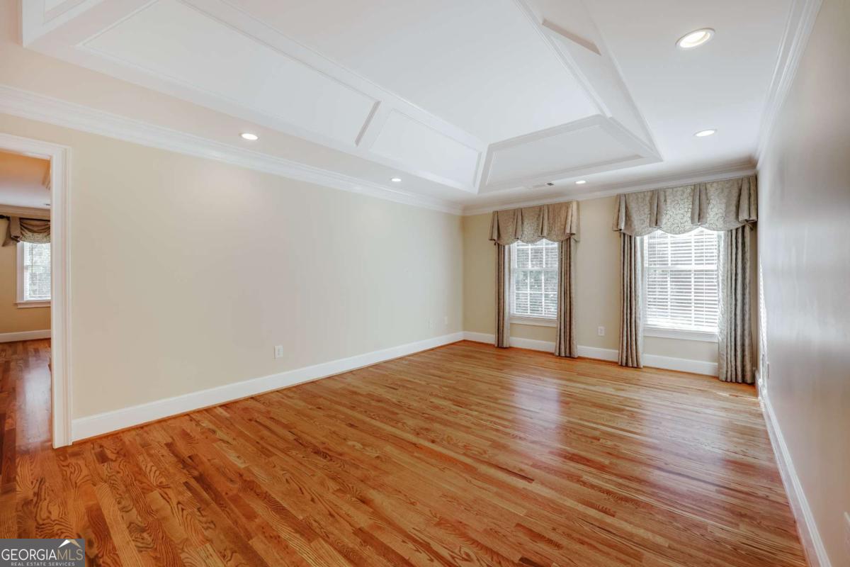 150 Walton Creek Road Athens, GA 30607 - Photo 35 of 72 a view of an empty room with wooden floor and a window