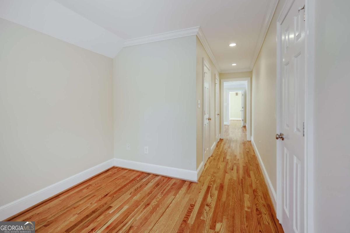 150 Walton Creek Road Athens, GA 30607 - Photo 42 of 72 a view of a room with wooden floor and bench