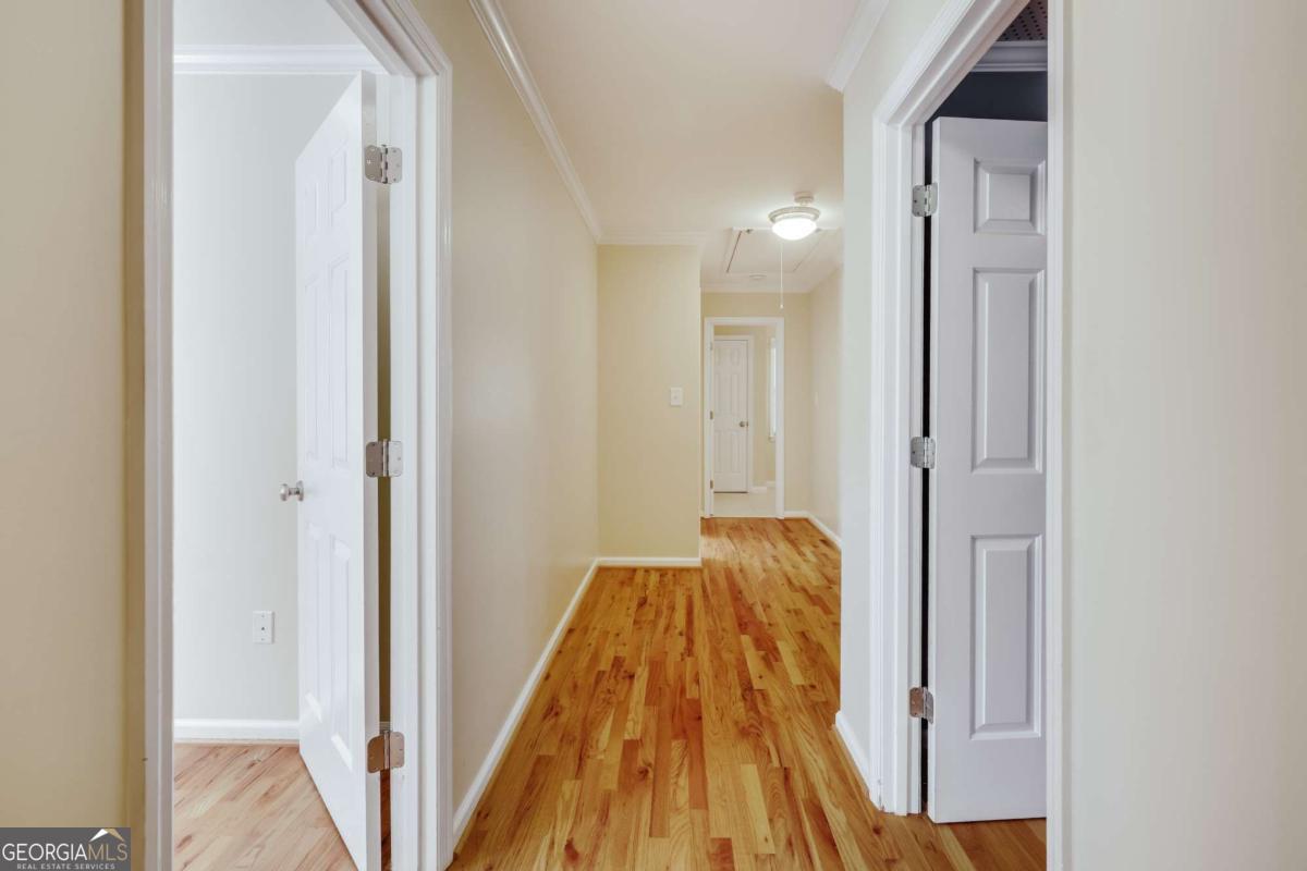 150 Walton Creek Road Athens, GA 30607 - Photo 43 of 72 a view of hallway with wooden floor