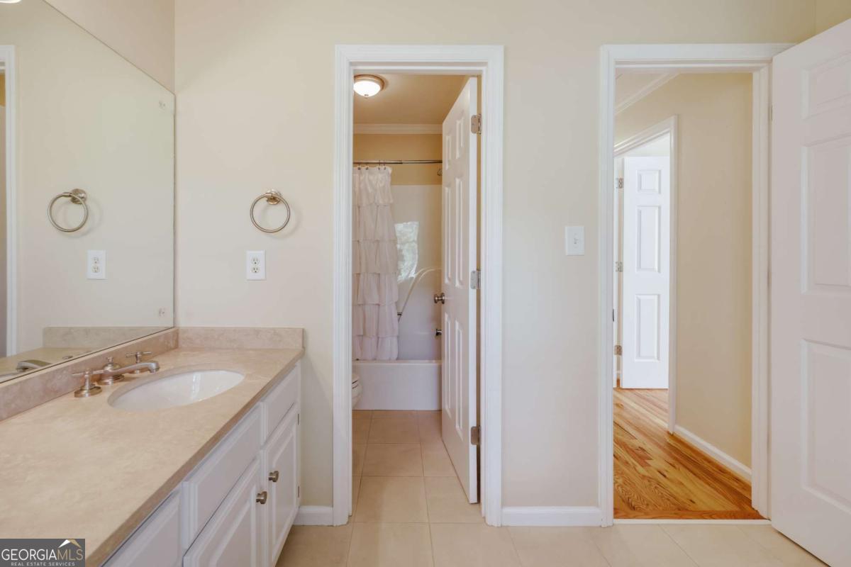 150 Walton Creek Road Athens, GA 30607 - Photo 50 of 72 a bathroom with a sink and a mirror