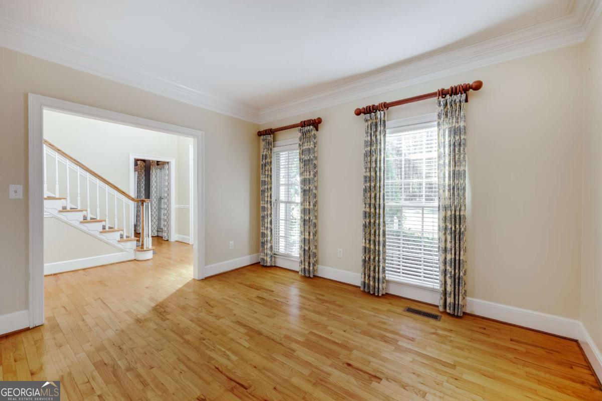 150 Walton Creek Road Athens, GA 30607 - Photo 9 of 72 wooden floor in an empty room with a window