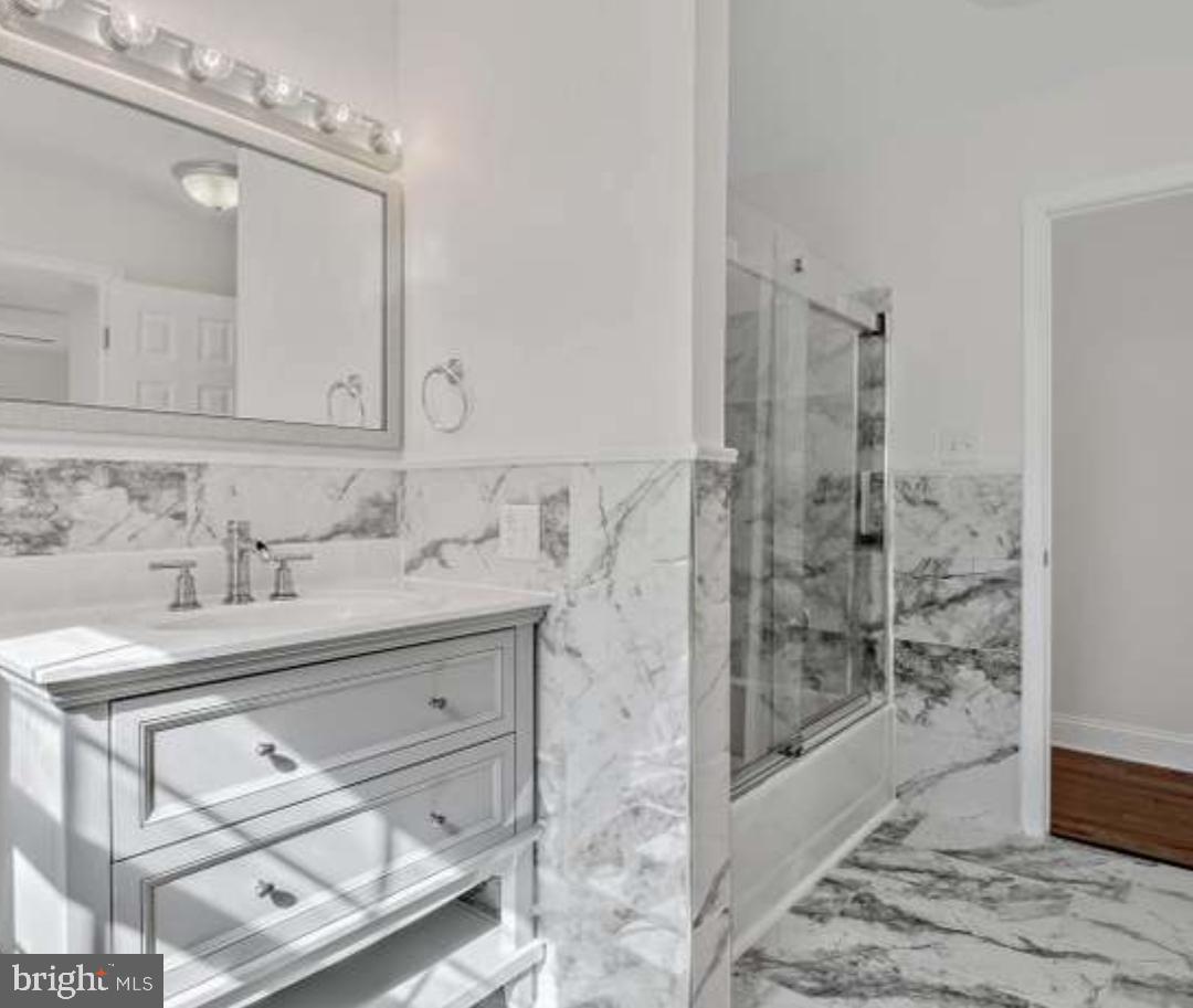 40 Sandy Court Hanover, PA 17331 - Photo 8 of 19 a bathroom with a sink mirror and shower