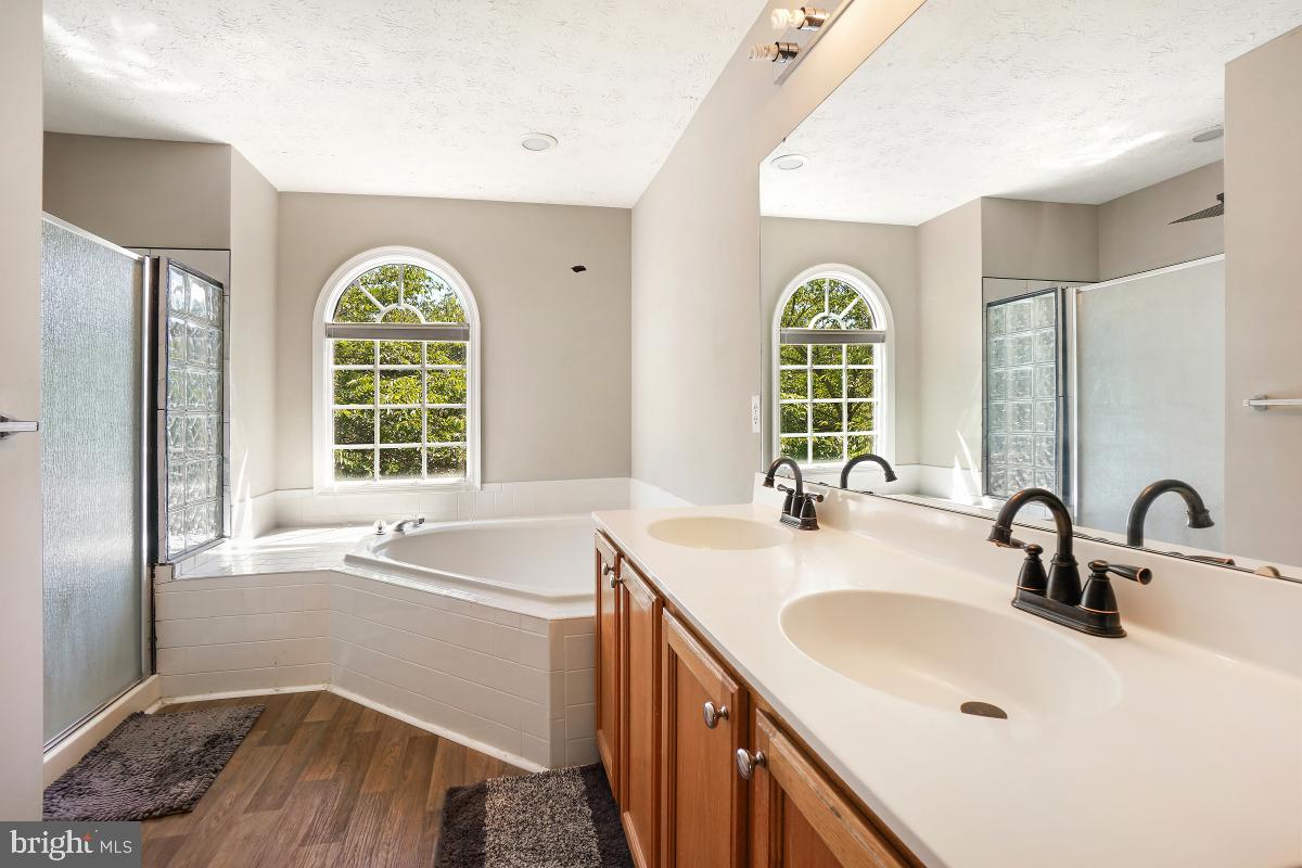 8114 Bell Tower Crossing Pasadena, MD 21122 - Photo 28 of 44 Primary Bathroom