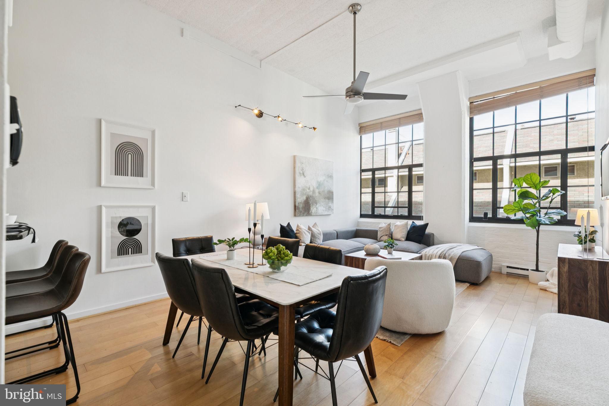 a view of a dining room with furniture and window