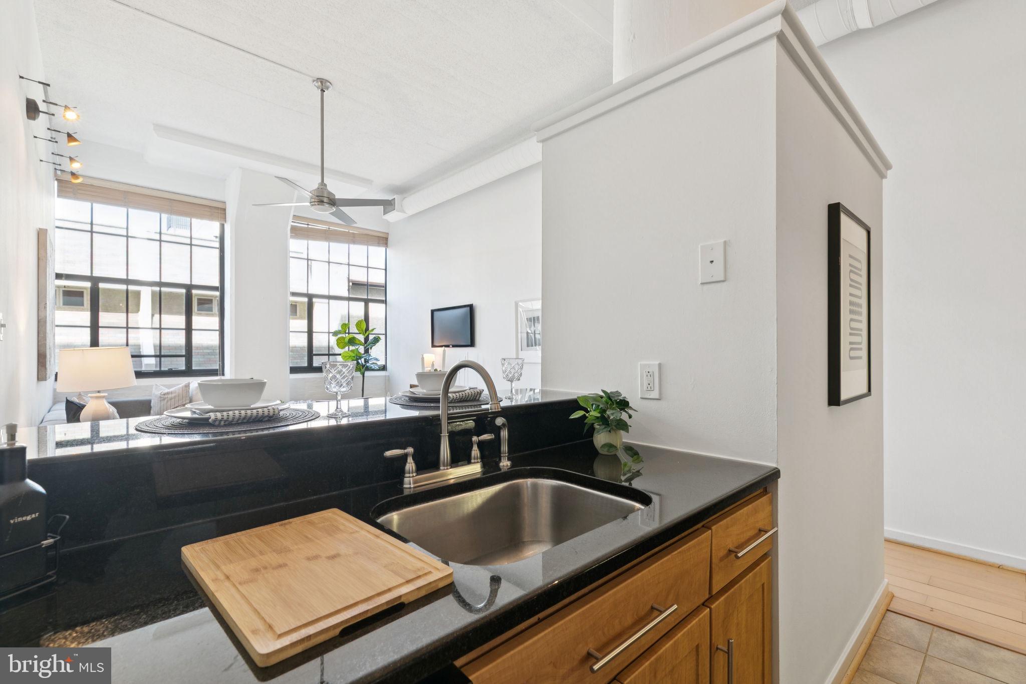 2429 Locust Street, Unit 318 Philadelphia, PA 19103 - Photo 11 of 35 a kitchen with a sink and a refrigerator