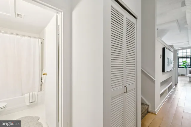 a view of a hallway with paintings on the wall