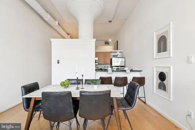 a view of a dining room with furniture and wooden floor
