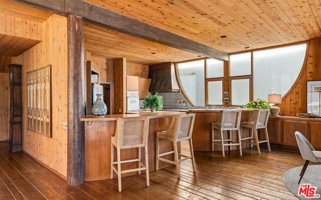 a view of living room with furniture and large window