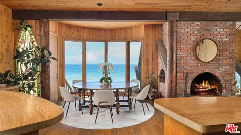 a view of living room with furniture and floor to ceiling windows