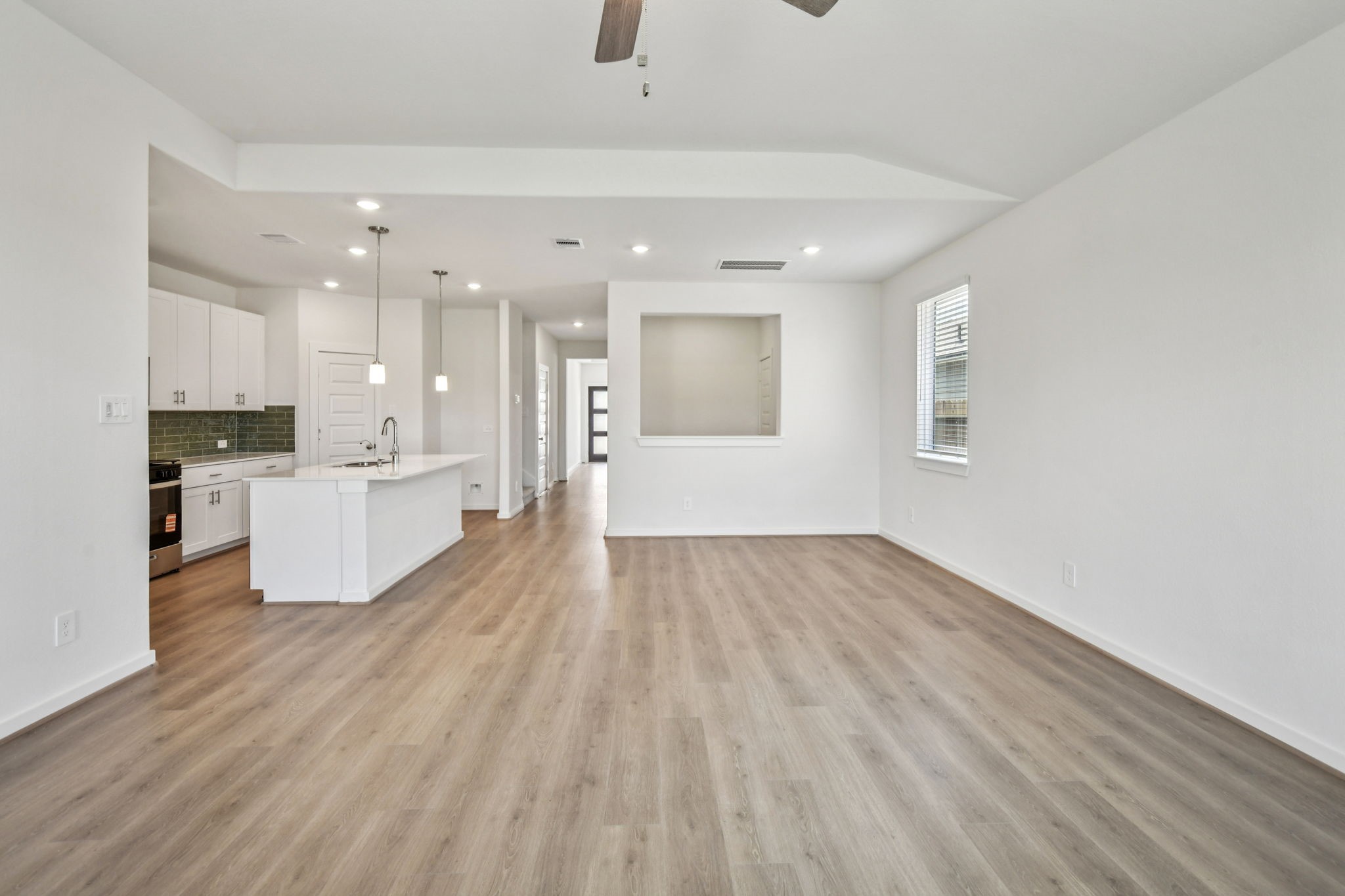 6631 Castella Drive Rosharon, TX 77583 - Photo 12 of 47 a view of a kitchen with wooden floor and windows