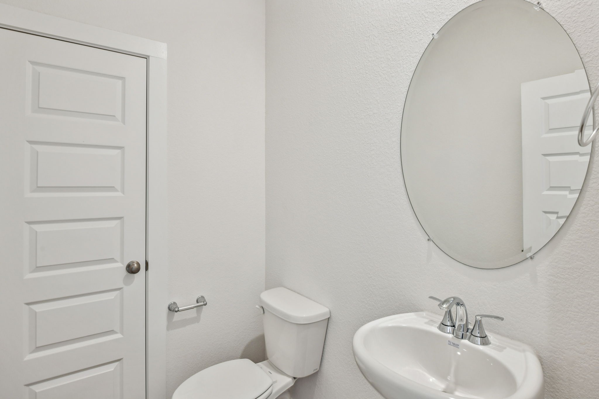 6631 Castella Drive Rosharon, TX 77583 - Photo 18 of 47 a bathroom with a toilet a sink and a mirror