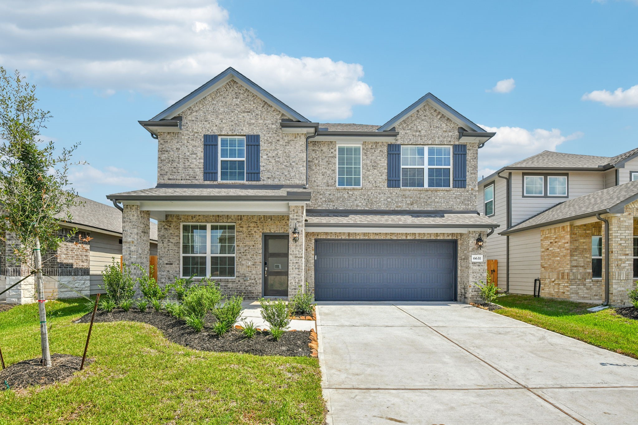 6631 Castella Drive Rosharon, TX 77583 - Photo 2 of 47 a front view of a house with garden