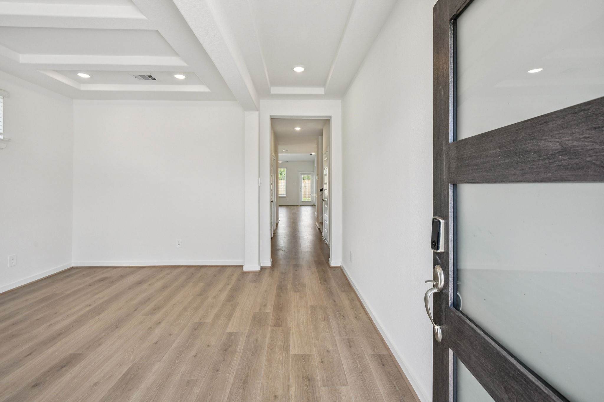 6631 Castella Drive Rosharon, TX 77583 - Photo 3 of 47 a view of a hallway with wooden floor