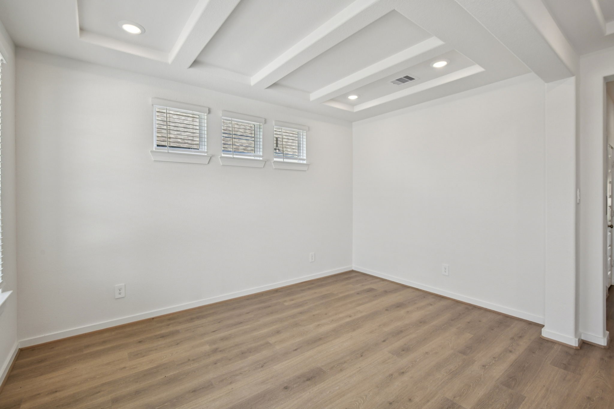6631 Castella Drive Rosharon, TX 77583 - Photo 4 of 47 a view of a room with wooden floor and white walls