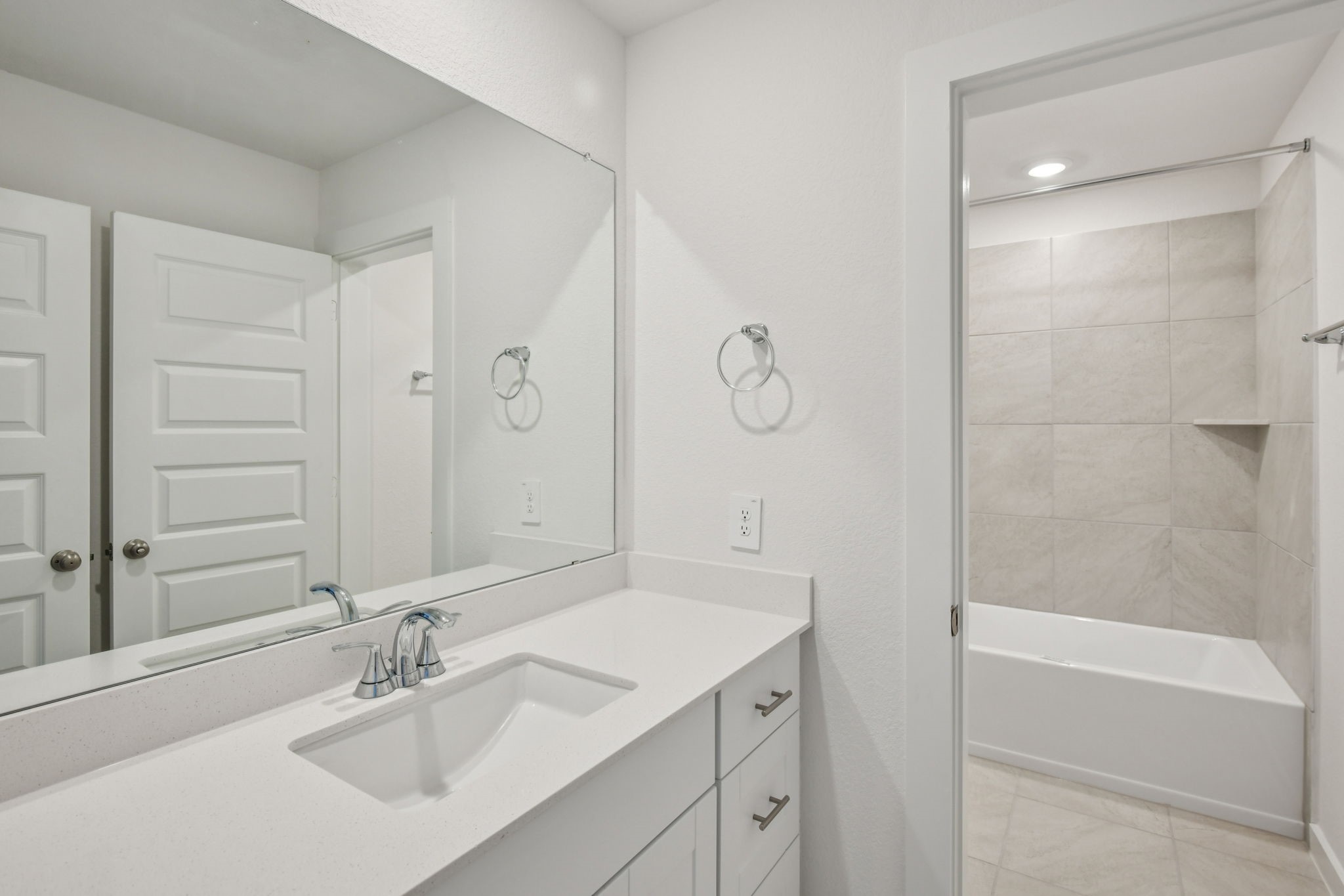 6631 Castella Drive Rosharon, TX 77583 - Photo 43 of 47 a bathroom with a shower sink vanity and mirror