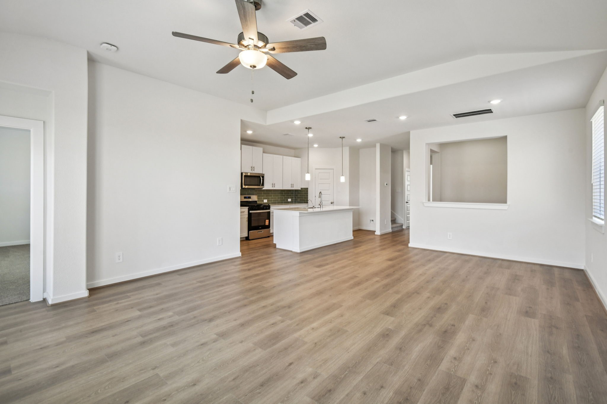 6631 Castella Drive Rosharon, TX 77583 - Photo 10 of 47 a view of a kitchen with a sink and a refrigerator