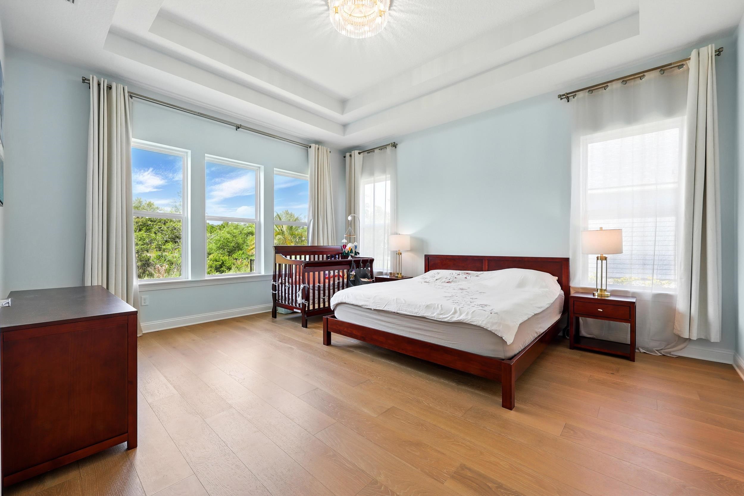 164 Tesoro Terrace St. Augustine, FL 32095 - Photo 21 of 55 a spacious bedroom with a bed and a large window