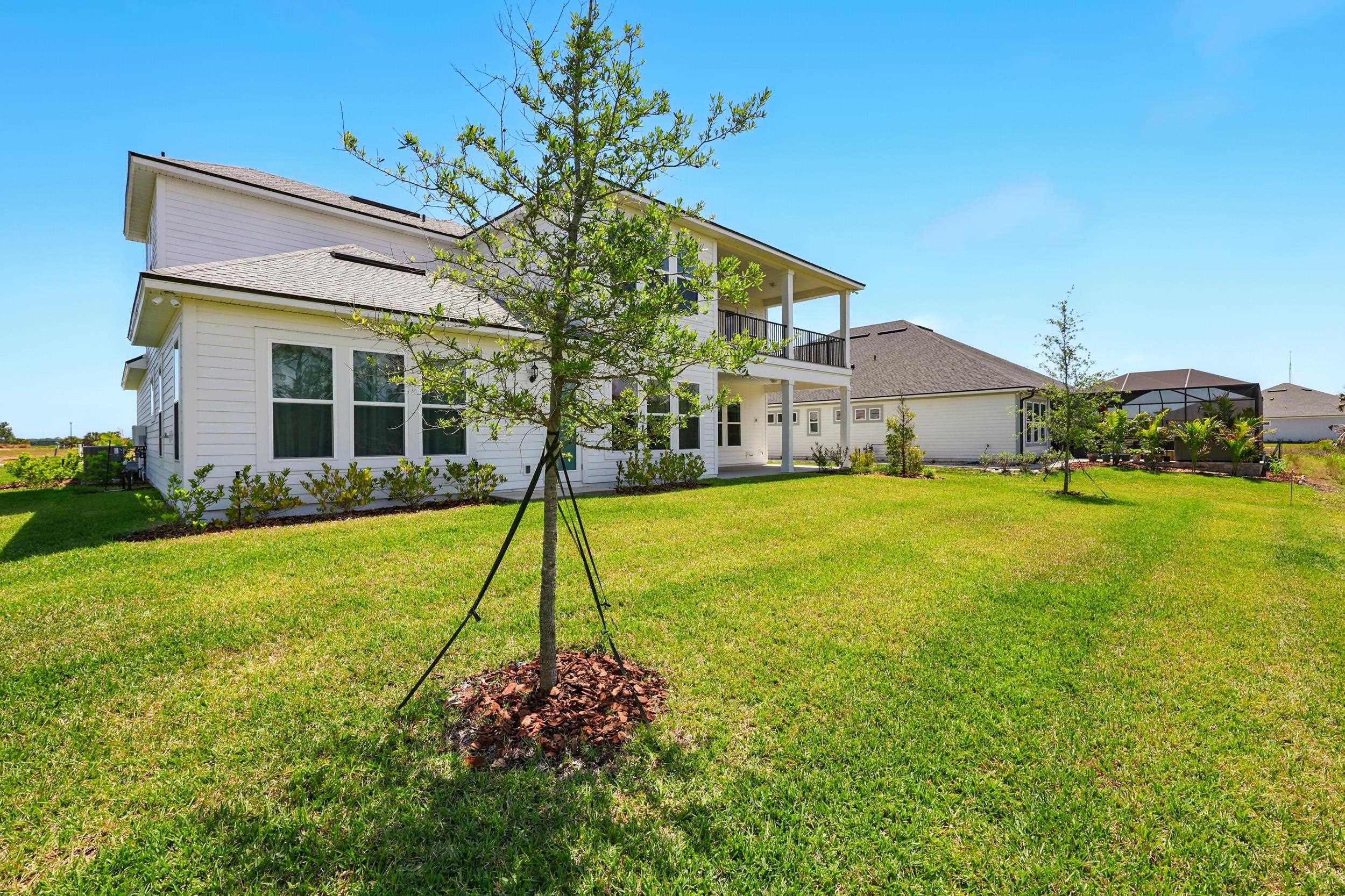 164 Tesoro Terrace St. Augustine, FL 32095 - Photo 39 of 55 a house view with a garden space