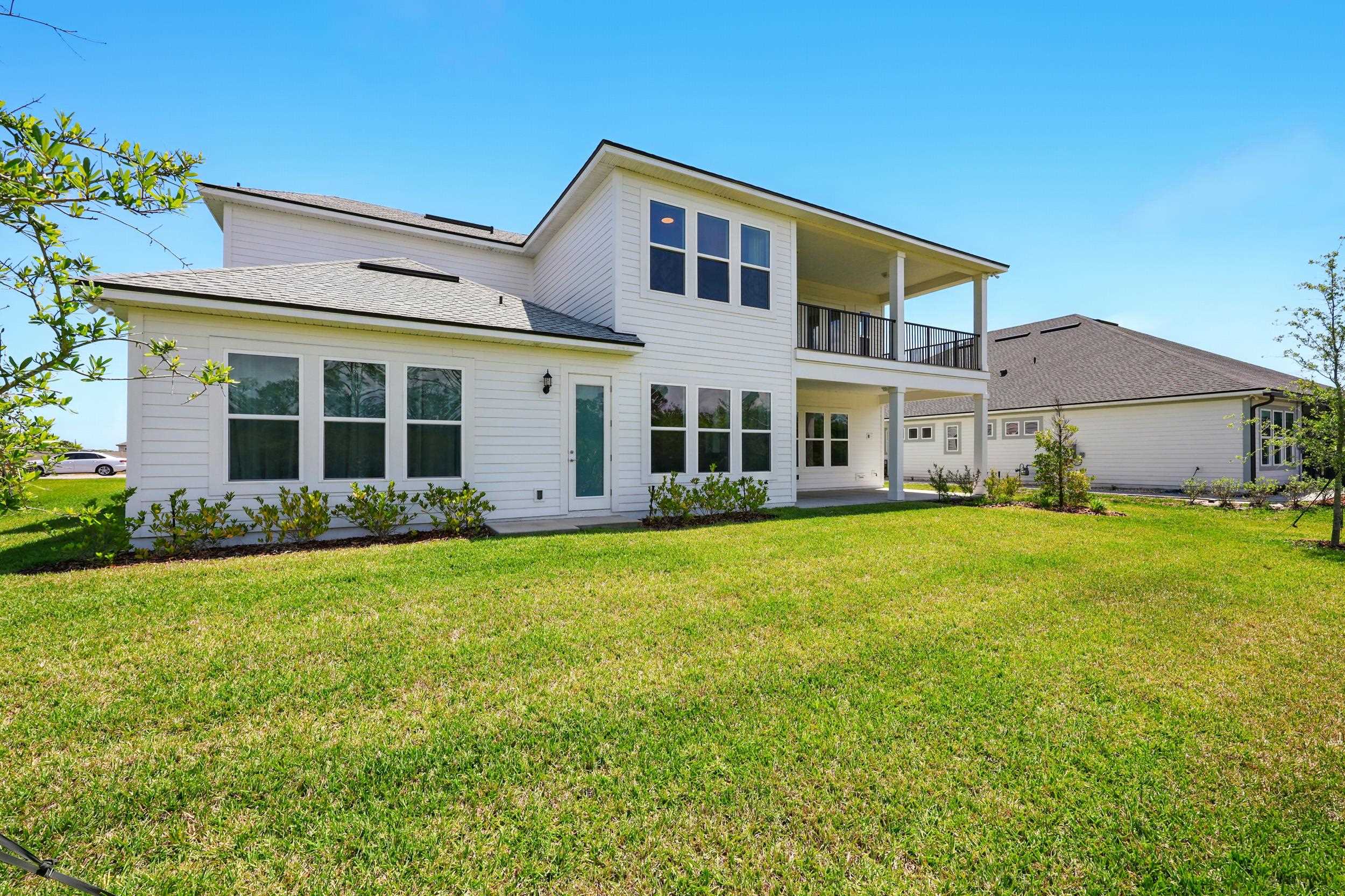 164 Tesoro Terrace St. Augustine, FL 32095 - Photo 40 of 55 front view of a house with a garden