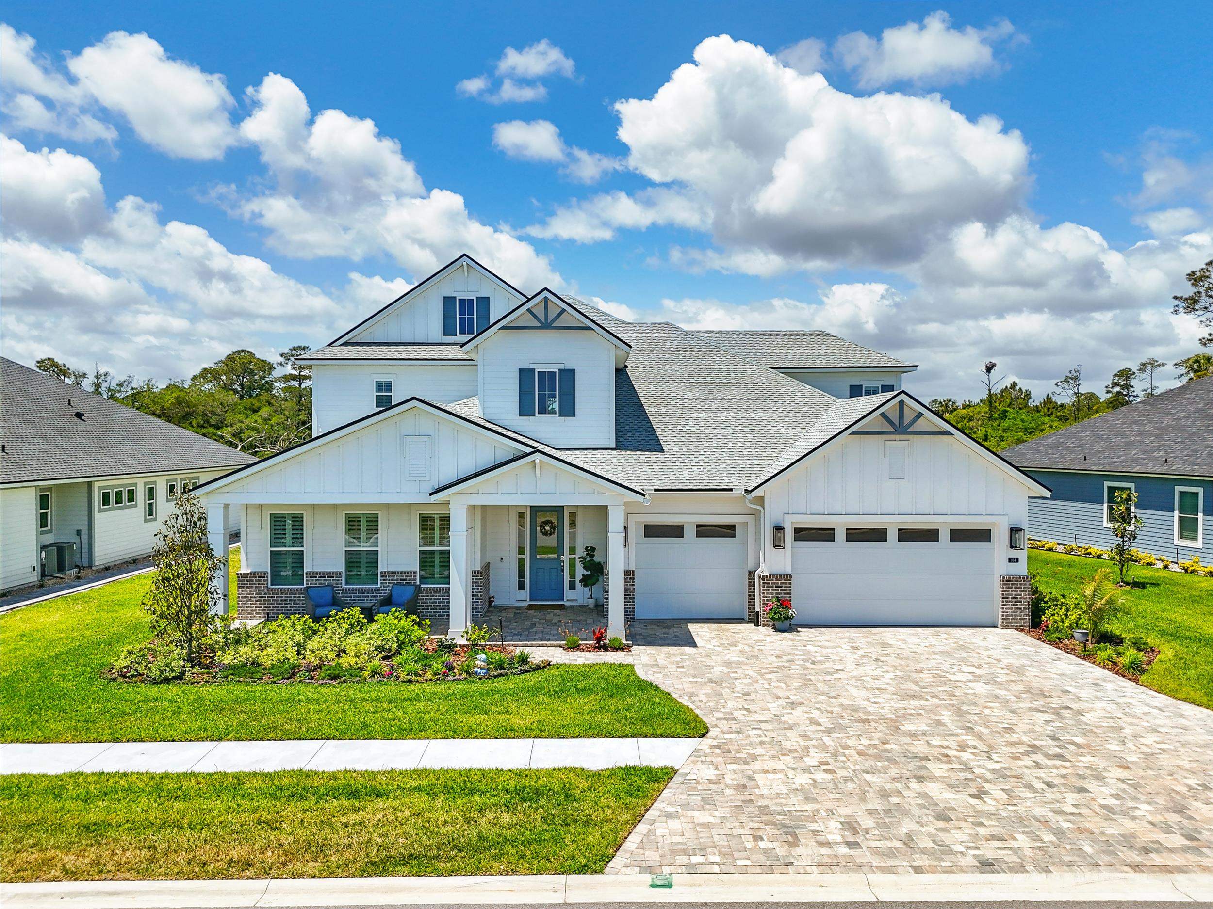 164 Tesoro Terrace St. Augustine, FL 32095 - Photo 45 of 55 a front view of a house with a garden