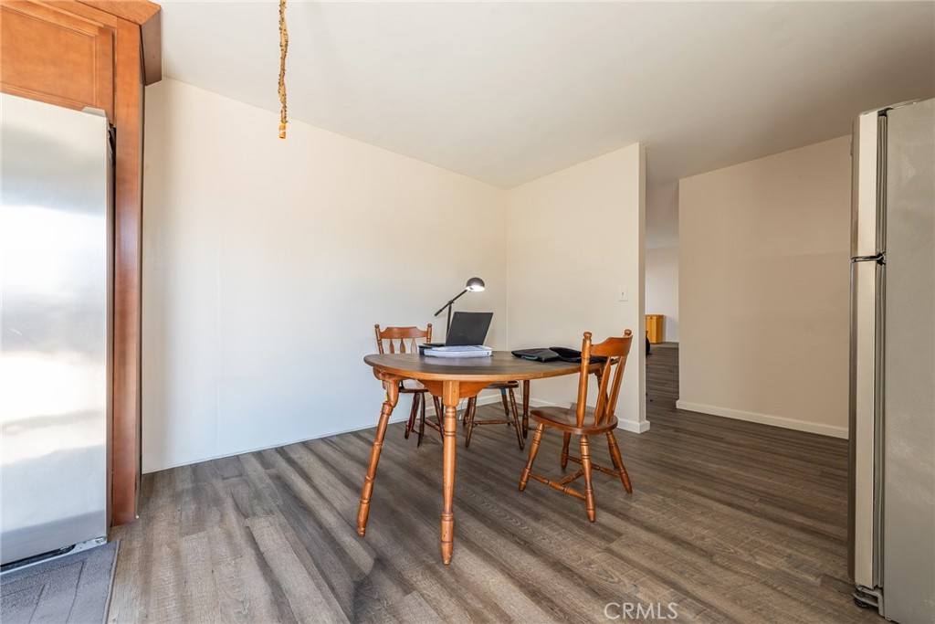 6732 San Joaquin Way Riverside, CA 92503 - Photo 14 of 25 a workspace with furniture and wooden floor