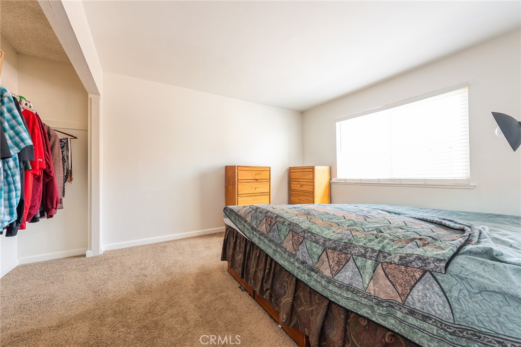 6732 San Joaquin Way Riverside, CA 92503 - Photo 7 of 25 a bedroom with a bed and a window