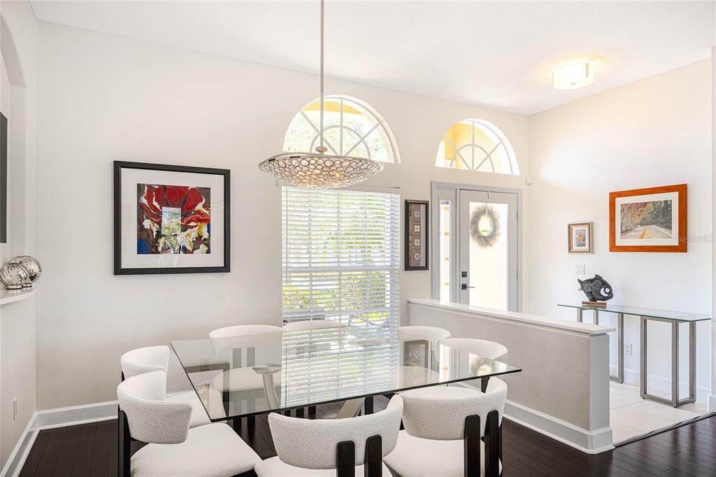 956 Scherer Way Osprey, FL 34229 - Photo 13 of 38 a view of a dining room with furniture window and wooden floor