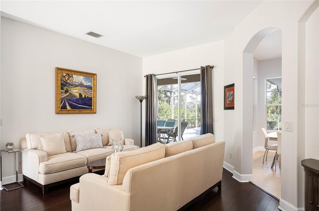 956 Scherer Way Osprey, FL 34229 - Photo 15 of 38 a living room with furniture and a large window