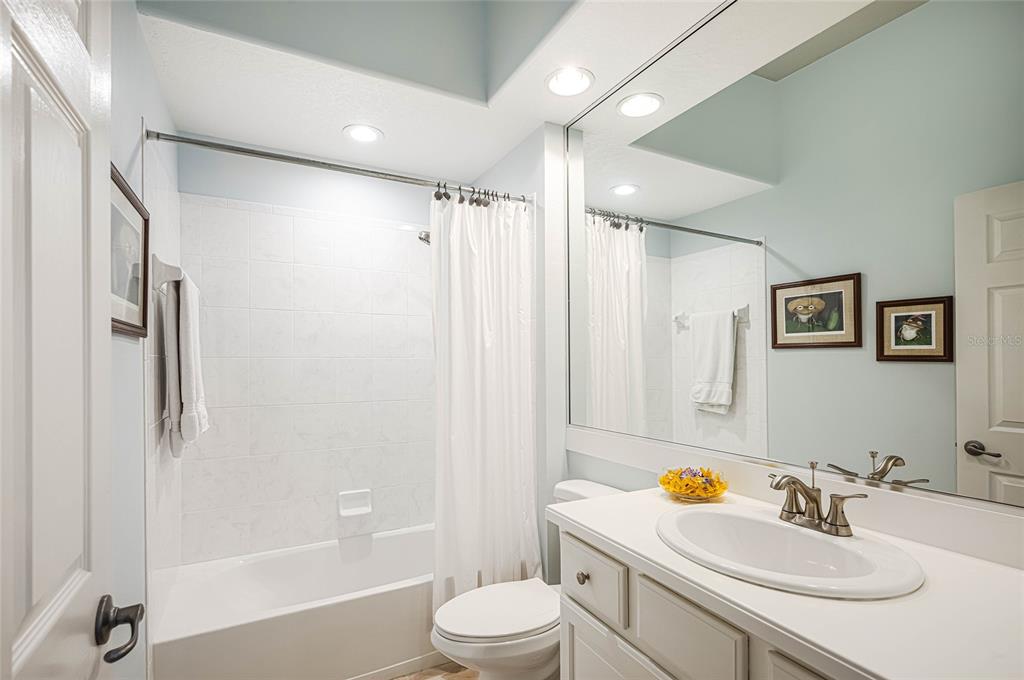 956 Scherer Way Osprey, FL 34229 - Photo 22 of 38 a bathroom with a sink toilet and shower