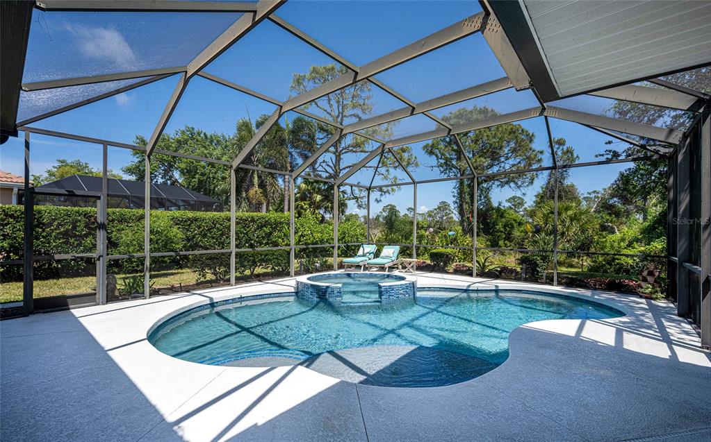 956 Scherer Way Osprey, FL 34229 - Photo 3 of 38 a view of a backyard with sitting area