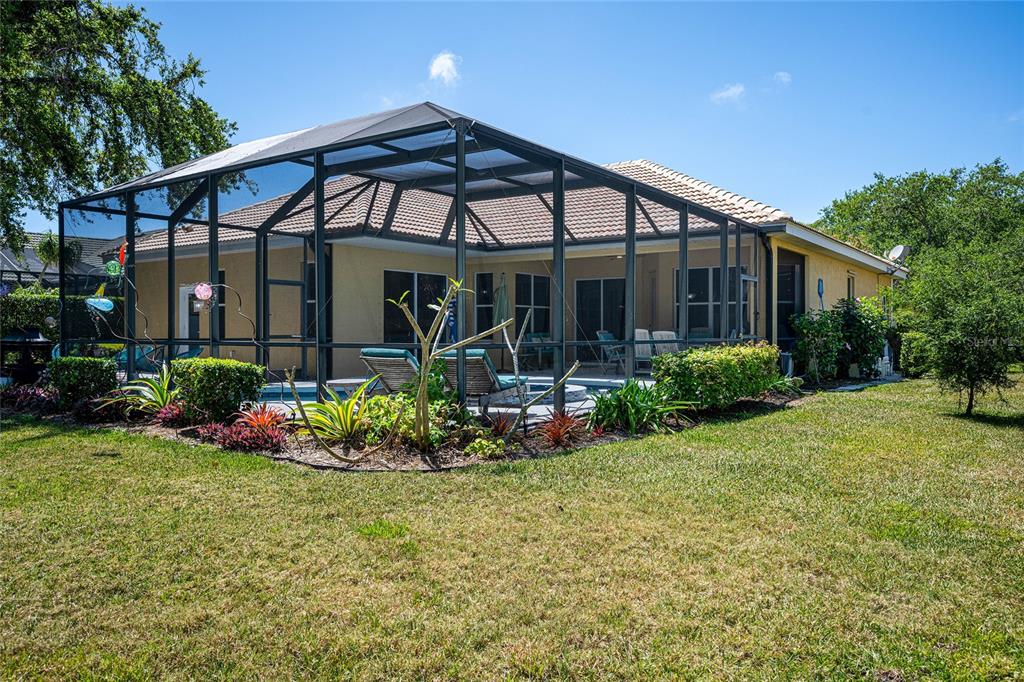 956 Scherer Way Osprey, FL 34229 - Photo 31 of 38 a front view of a house with garden