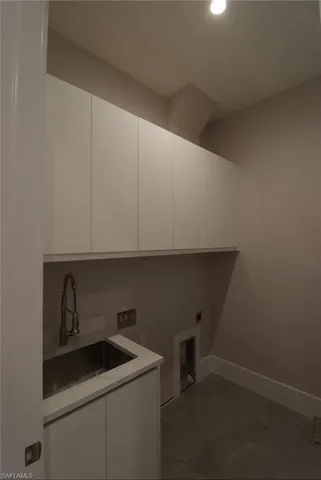 a view of an empty room with glass door and balcony