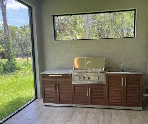 a view of a room with furniture wooden floor and window