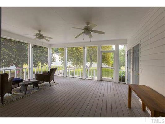 9123 South Lowell Road Bahama, NC 27503 - Photo 20 of 25 A huge screened porch, accessed from the great room, has plenty of room for family and friends and is also the access for the sauna and for the pool Screened Porch