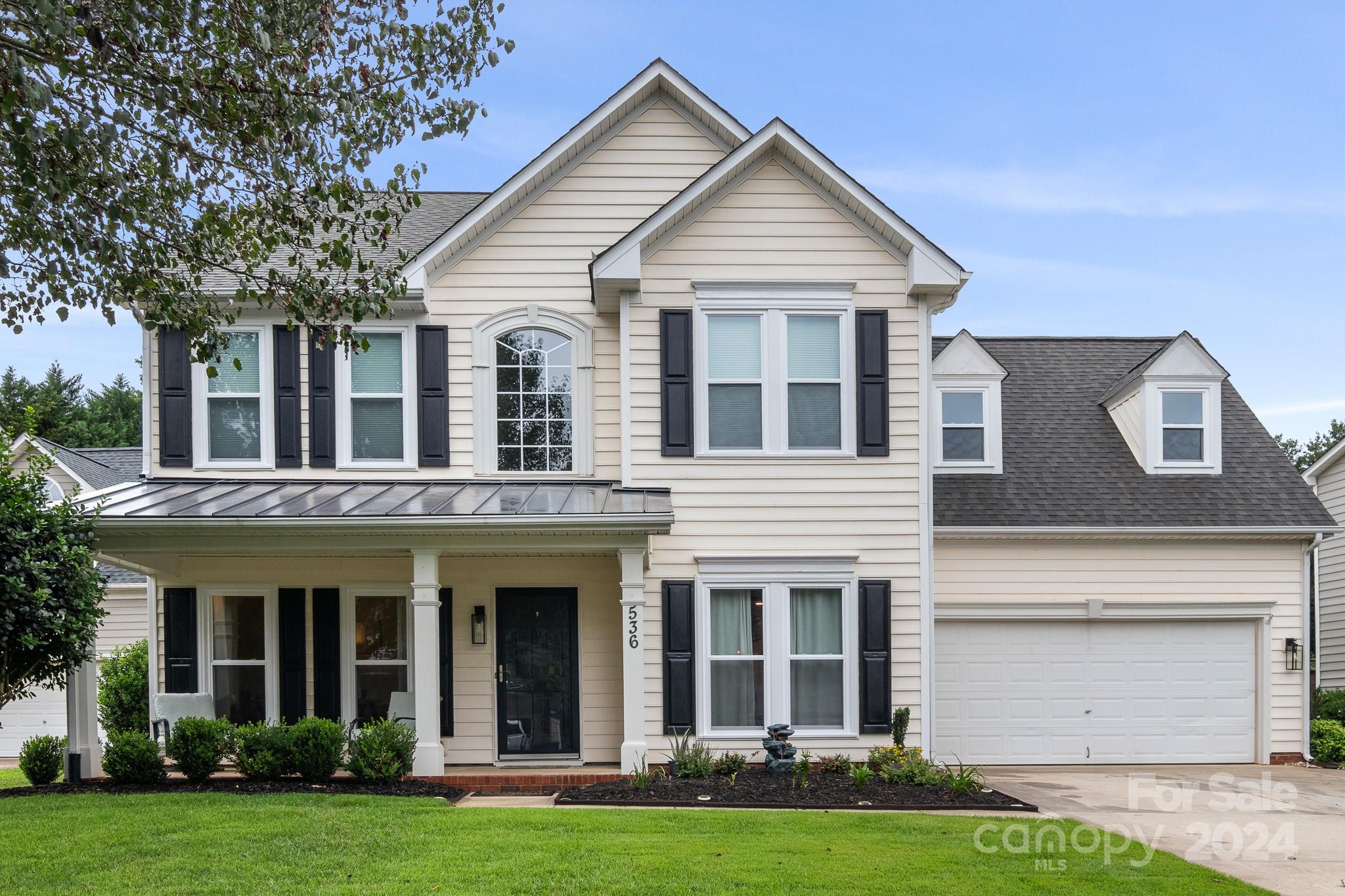 536 St George Road Fort Mill, SC 29708 - Photo 1 of 48 a front view of a house with a yard and garage