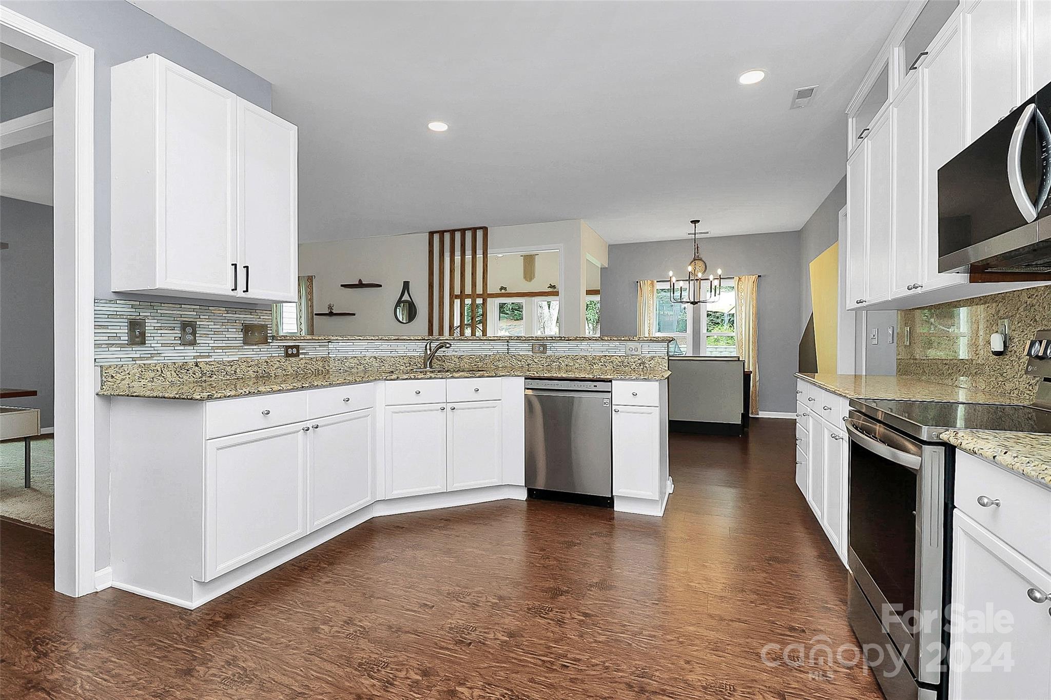 536 St George Road Fort Mill, SC 29708 - Photo 15 of 48 a kitchen with a sink stove cabinets and wooden floor