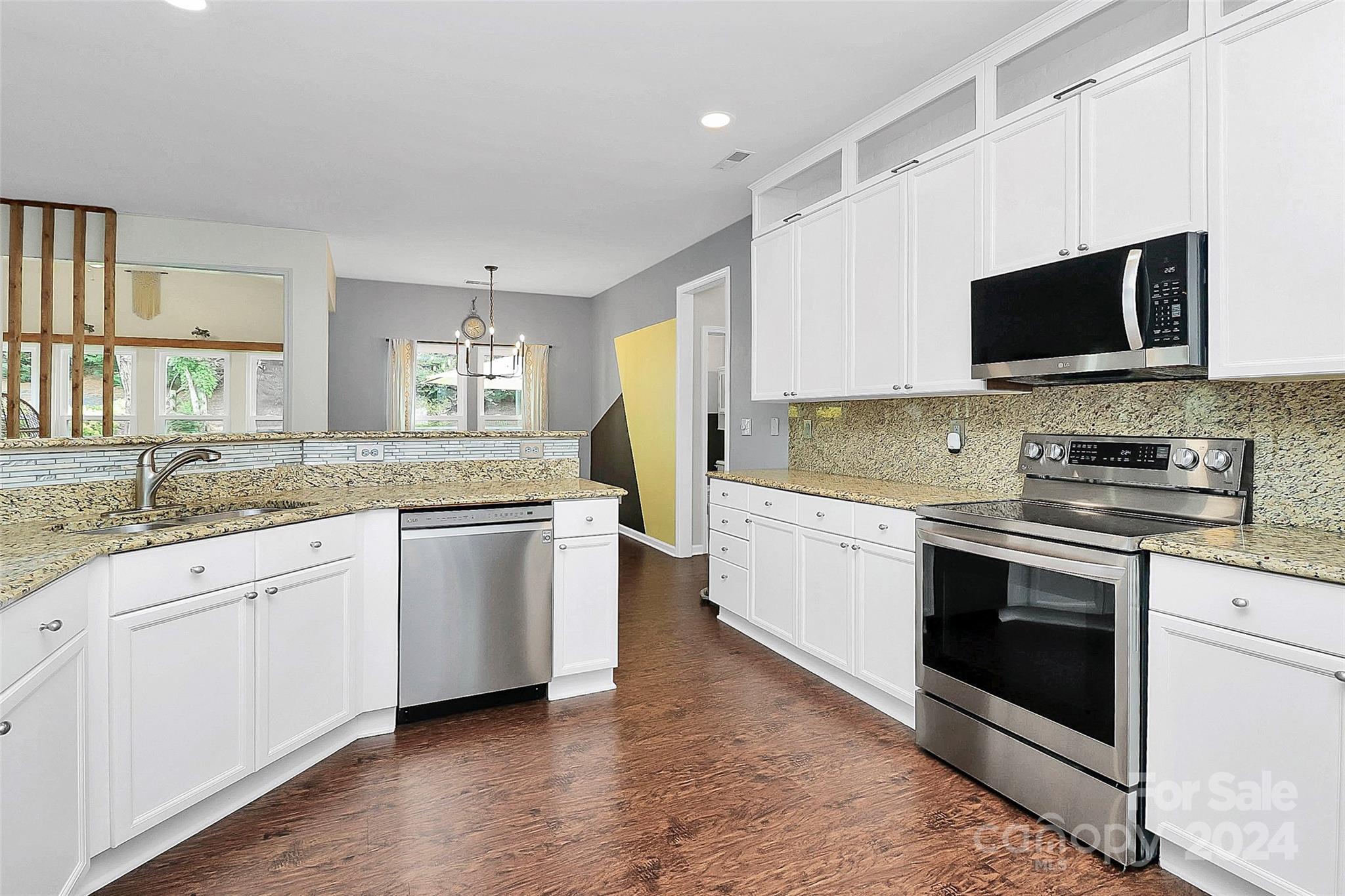 536 St George Road Fort Mill, SC 29708 - Photo 16 of 48 a kitchen with granite countertop white cabinets and white appliances