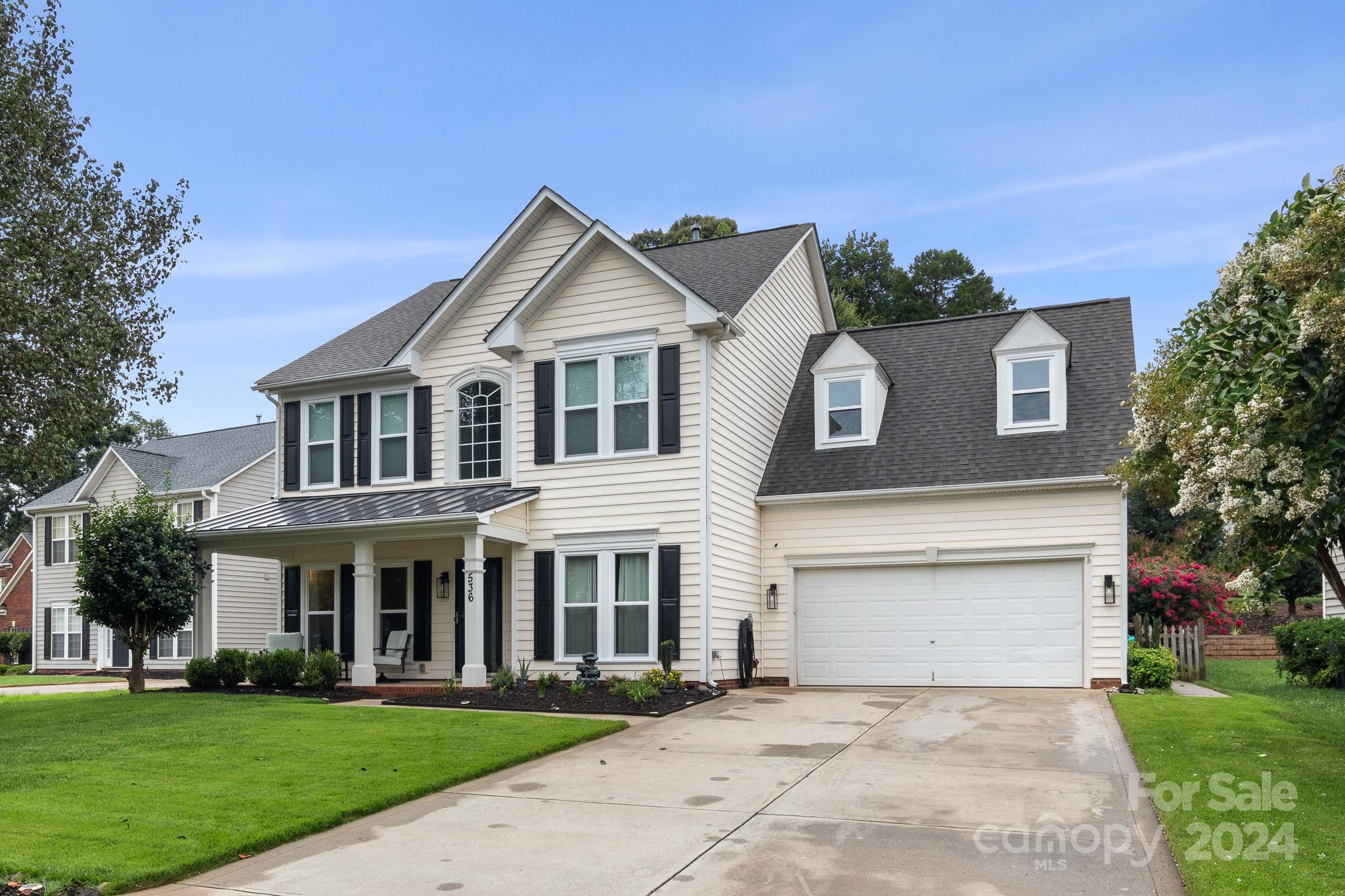 536 St George Road Fort Mill, SC 29708 - Photo 2 of 48 a front view of a house with a yard and trees