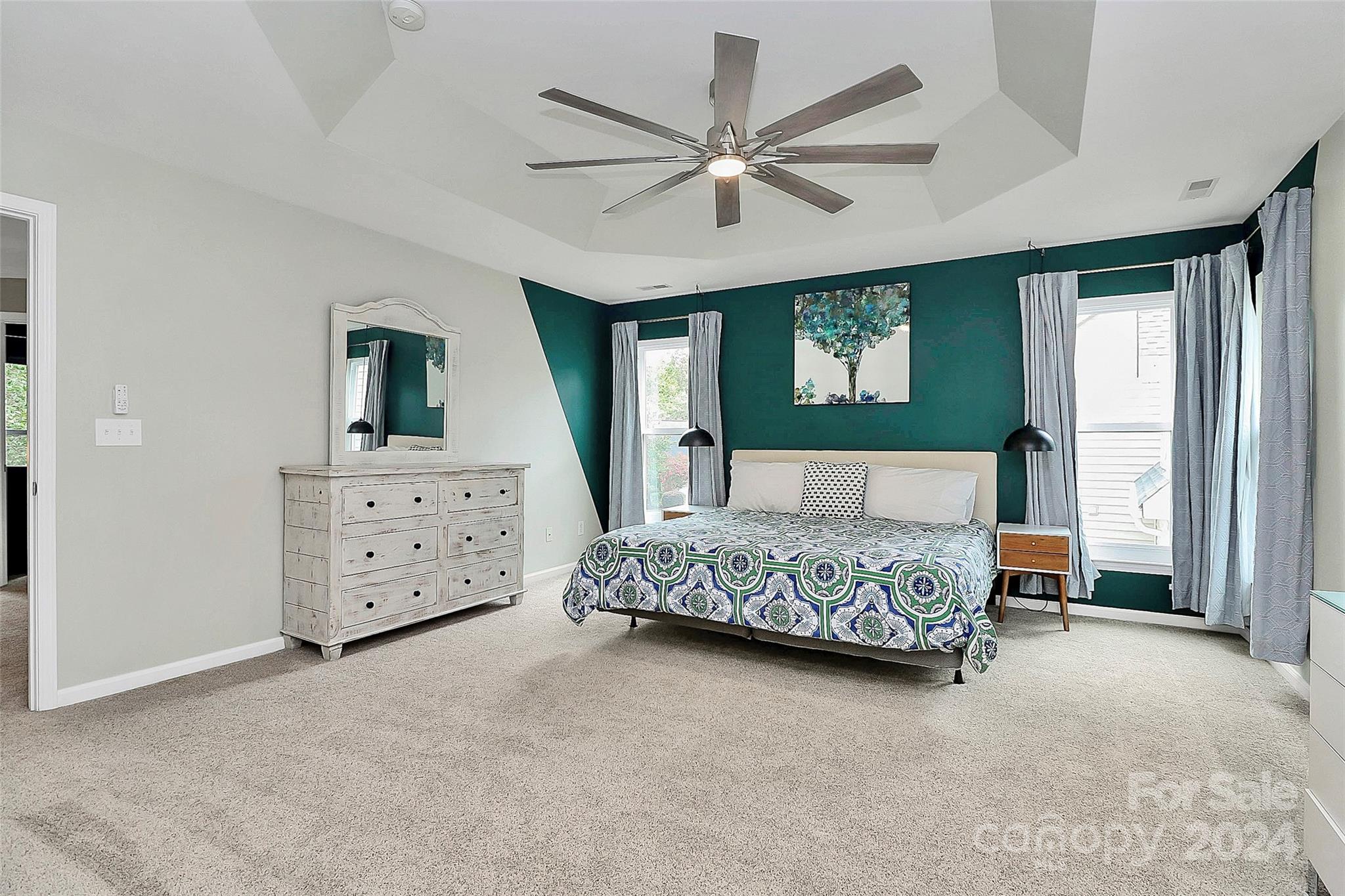 536 St George Road Fort Mill, SC 29708 - Photo 32 of 48 a bedroom with a large bed and a chandelier